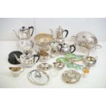 A large collection of silver plated wares, to include: a footed serving dish of shell shaped design,