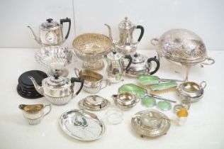 A large collection of silver plated wares, to include: a footed serving dish of shell shaped design,