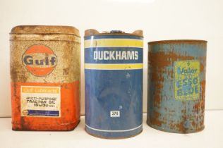 Three mid Century advertising oil cans to include Gulf, Duckham and Valor. Measures 48cm tall.