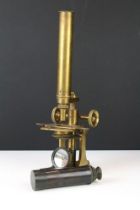 Newton & Co of London Victorian brass microscope with rack & pinion focusing, raised upon a Y-shaped