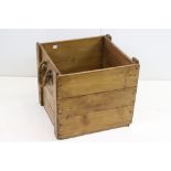 A vintage pine log box with rope handles