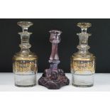 Pair of 19th Century faceted glass decanters with gilt decoration together with a Victorian purple