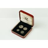 A United Kingdom Royal Mint 1962 Silver Maundy Money Set Of Four Coins Within Red Display Case.