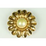 Chanel costume jewellery flower brooch having a large simulated pearl to the centre with gilt petals