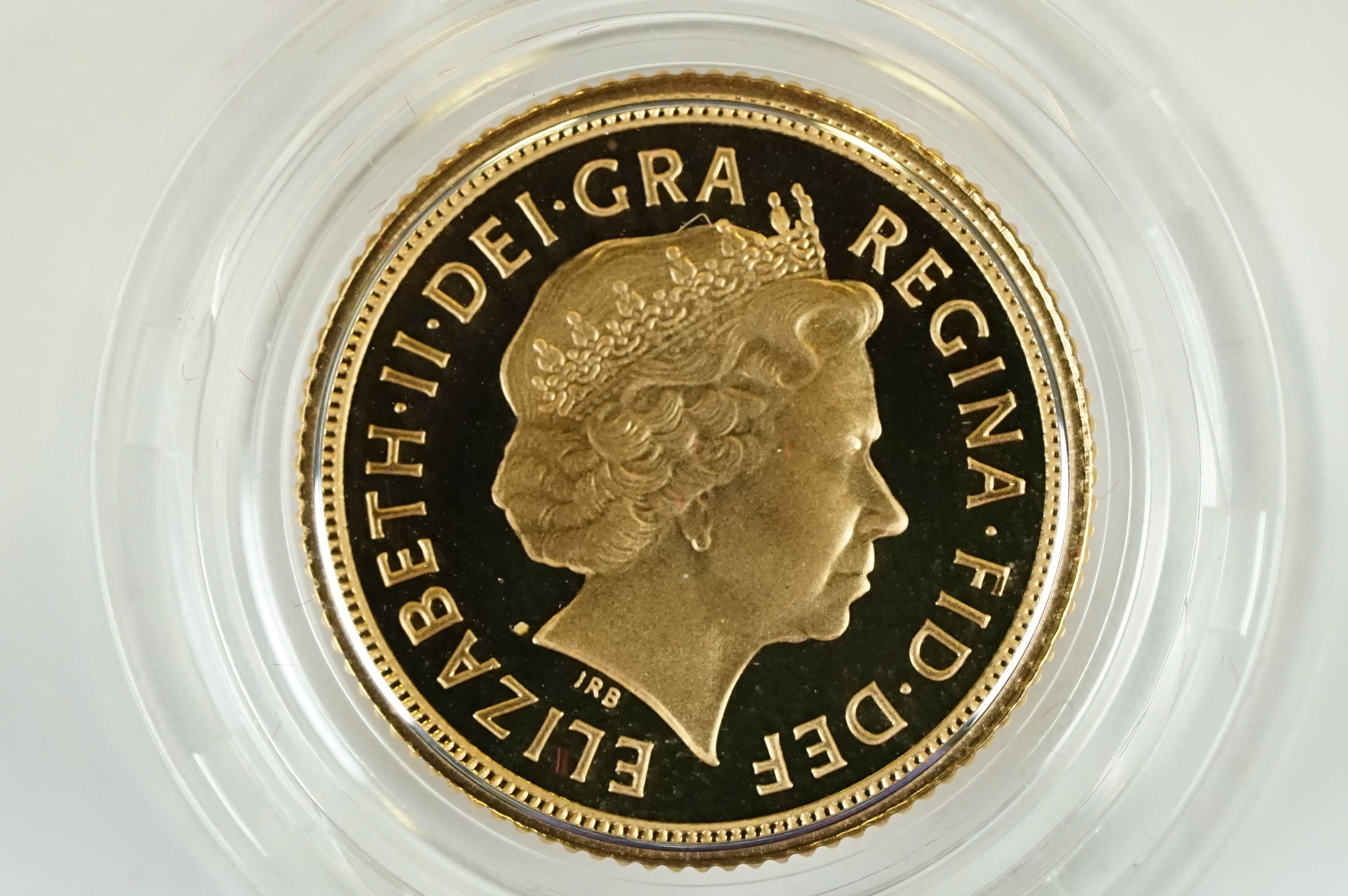 A Royal Mint United Kingdom 2005 gold proof half sovereign coin, encapsulated and set within red - Image 3 of 5