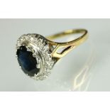 Sapphire and diamond halo dress ring being set with an oval cut blue sapphire with a halo of round