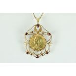 Victorian 1900 full sovereign coin set into an Edwardian open work pendant set with two pearls and