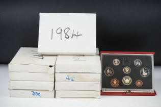 A collection of ten Royal Mint uncirculated coin year sets to include 1984, 1983, 1985, 1987 and