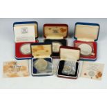 A Small Collection Of Cased Silver Proof Coins To Include 1977 Commemorative Crowns And A Mother