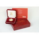 A Royal Mint United Kingdom 2005 gold proof half sovereign coin, encapsulated and set within red