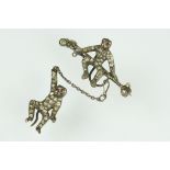 19th century paste silver brooch modelled as a monkey on a trapeze bar, suspending another monkey,