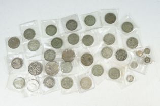 A collection of British pre decimal silver coins to include Crowns, half crowns, double florins,