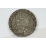 A British King George III 1787 silver shilling coin.