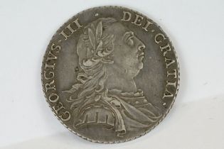 A British King George III 1787 silver shilling coin.