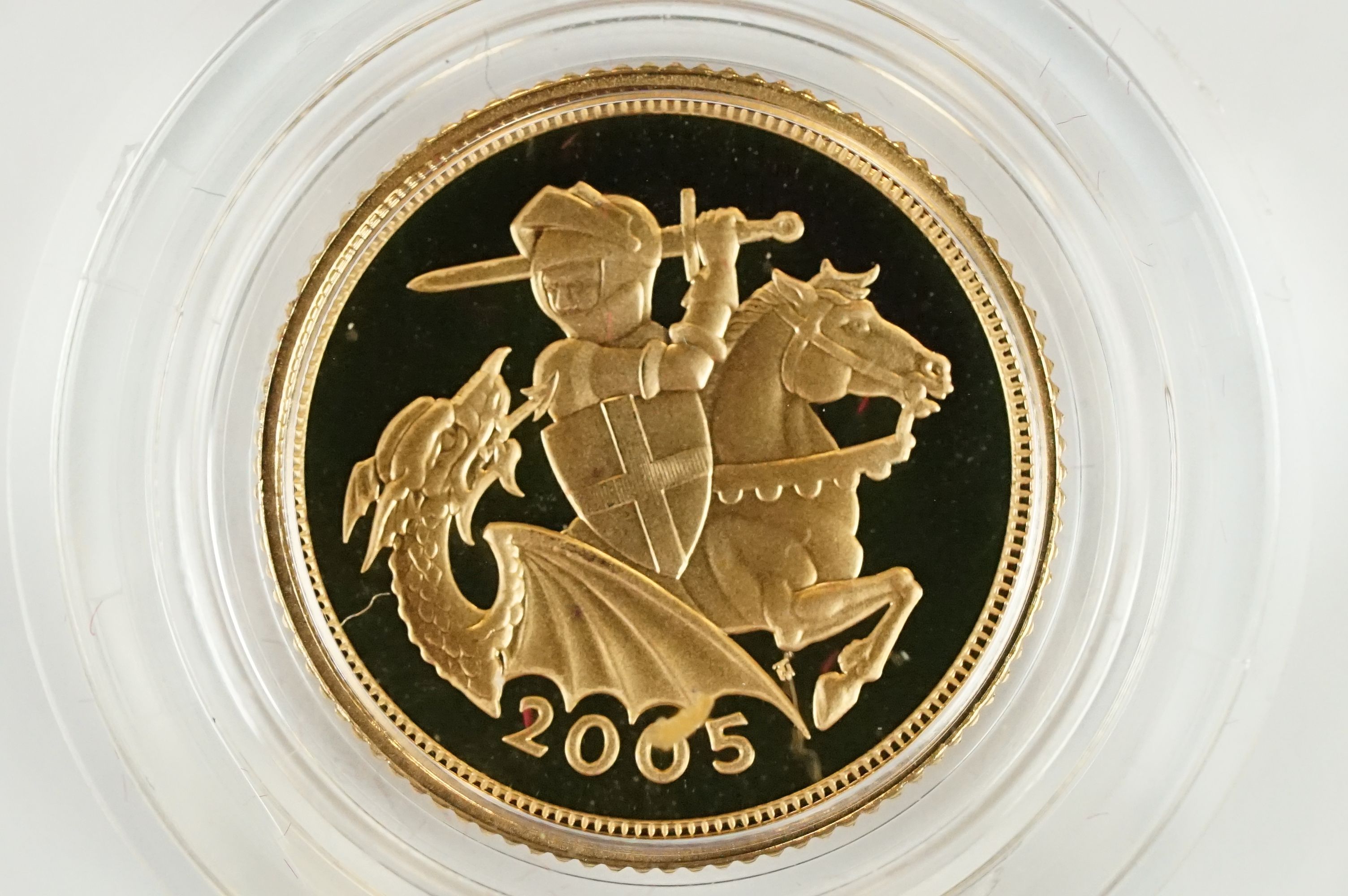 A Royal Mint United Kingdom 2005 gold proof half sovereign coin, encapsulated and set within red - Image 2 of 5