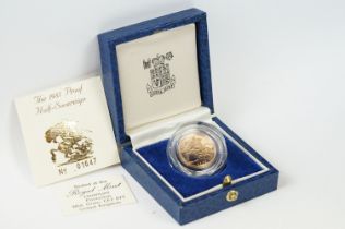 A British Royal Mint Queen Elizabeth II 1985 gold proof half sovereign coin within blue Royal Mint