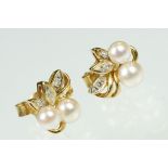 Pair of cultured pearl and diamond yellow metal stud earrings, two cream cultured pearls with pink