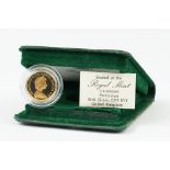 A British Royal Mint Queen Elizabeth II 1980 gold proof full sovereign coin within green Royal