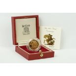A British Royal Mint Queen Elizabeth II 1985 gold proof full sovereign coin within red Royal Mint