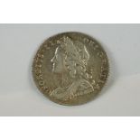A British King George II 1728 silver sixpence coin.