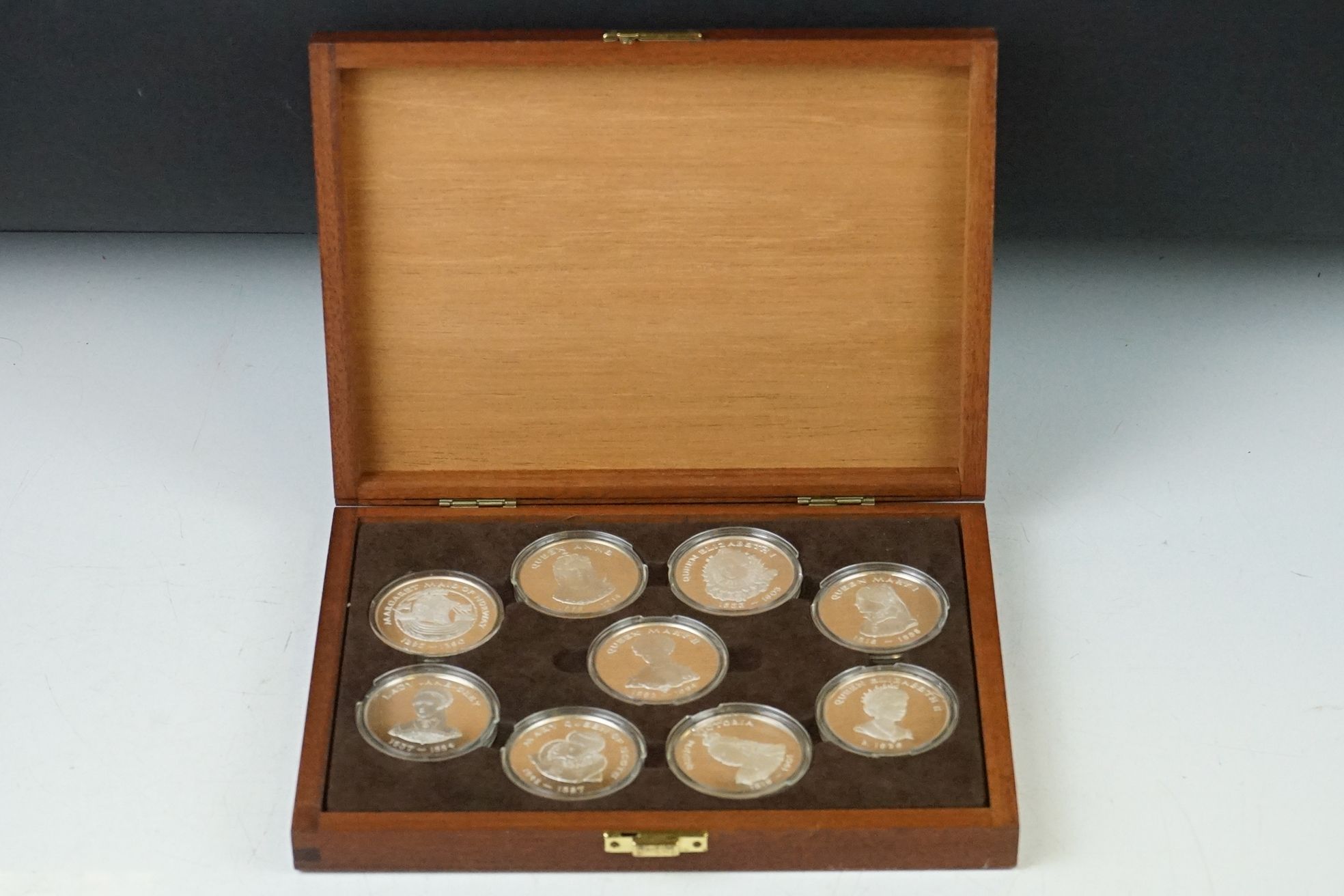 A Birmingham Mint 'Queens of the British Isles' fully hallmarked sterling silver medallion set, a