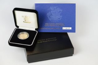 A Royal Mint United Kingdom 2005 gold proof full sovereign coin, encapsulated and set within black