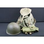 A small group of military collectables to include rucksack with frame, gas mask bag and steel helmet