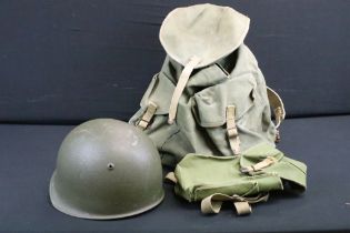 A small group of military collectables to include rucksack with frame, gas mask bag and steel helmet