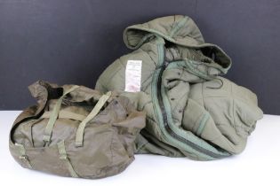 A vintage 1980's West German snipers sleeping system to include quilted sleeping bag with arms and