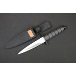 A Tech USA double edged steel dagger with rubber grip and original sheath.