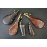 A collection of five late 19th / early 20th century leather powder flasks