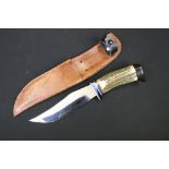 A Contemporary Ha Cayka sheath knife complete with fitted leather sheath.