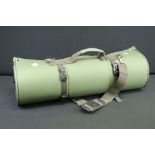 A green hunting / shooting portable padded ground sheet / mat.