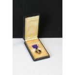 A United States Of America full size Purple Heart Medal For Military Merit, Named And Issued To