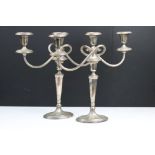 Pair of 'Yeoman' silver plated twin-branched candelabra, with swept reeded branches, raised upon