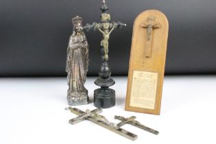 A small group of religious collectables to include crucifixes and a statue of the Virgin Mary.