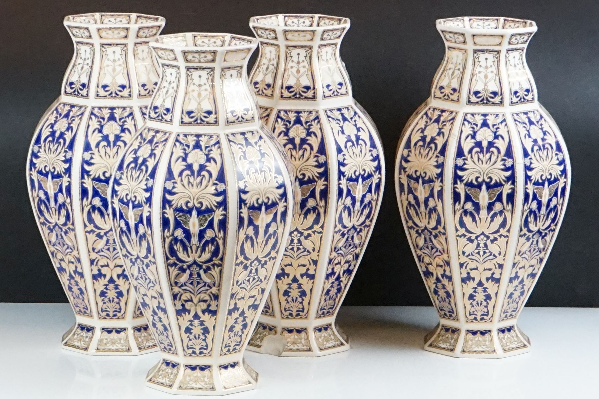 Set of four 20th Century ceramic vases of panelled octagonal design, each each having blue and