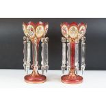 Pair of 19th Century Victorian cranberry glass lustres, each having scalloped rims with floral
