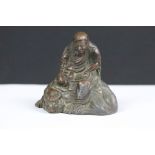An antique bronze Japanese sculpture sitting Daruma figure, stands approx 60mm in height.