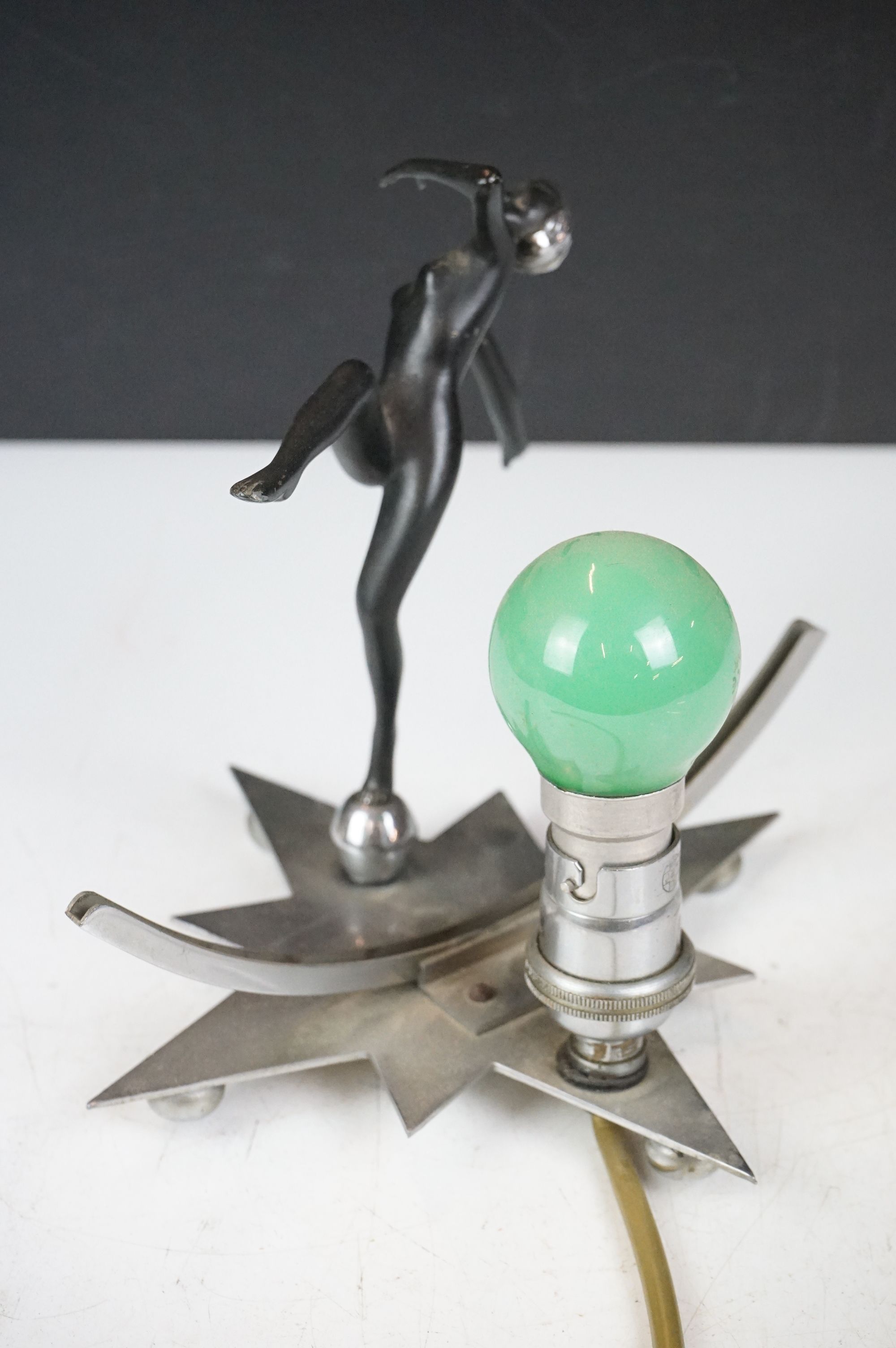 Art Deco wall lamp having a star shaped back plate with a nude female figure and green light bulb. - Image 4 of 9
