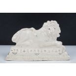 Early 20th Century ceramic lion flat back figurine, depicted crouched on a moulded base. Signed Lily