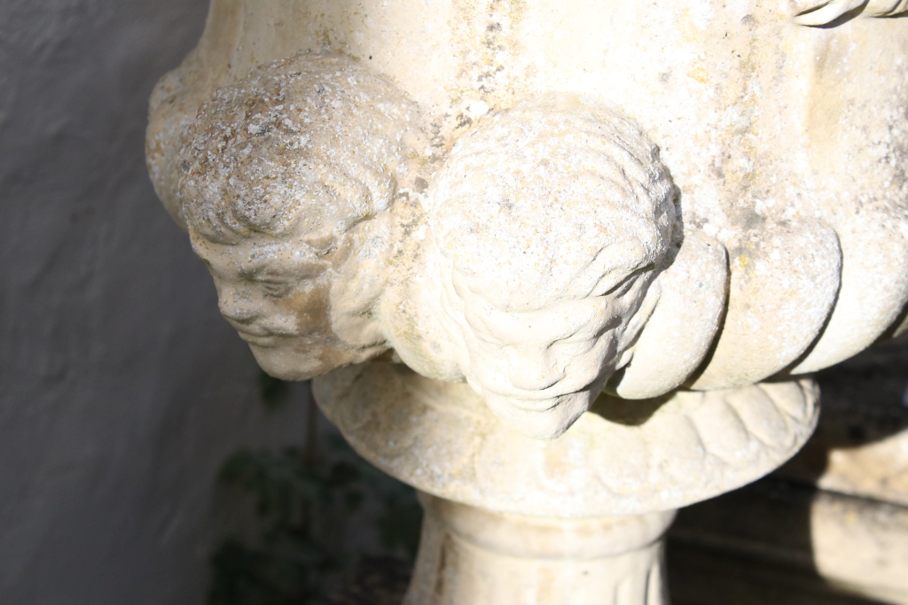 Pair of reconstituted stone garden urns of campana form, with relief facial mask decoration and - Image 3 of 3