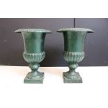 Pair of cast iron urn planters of classic form, approx 34cm high