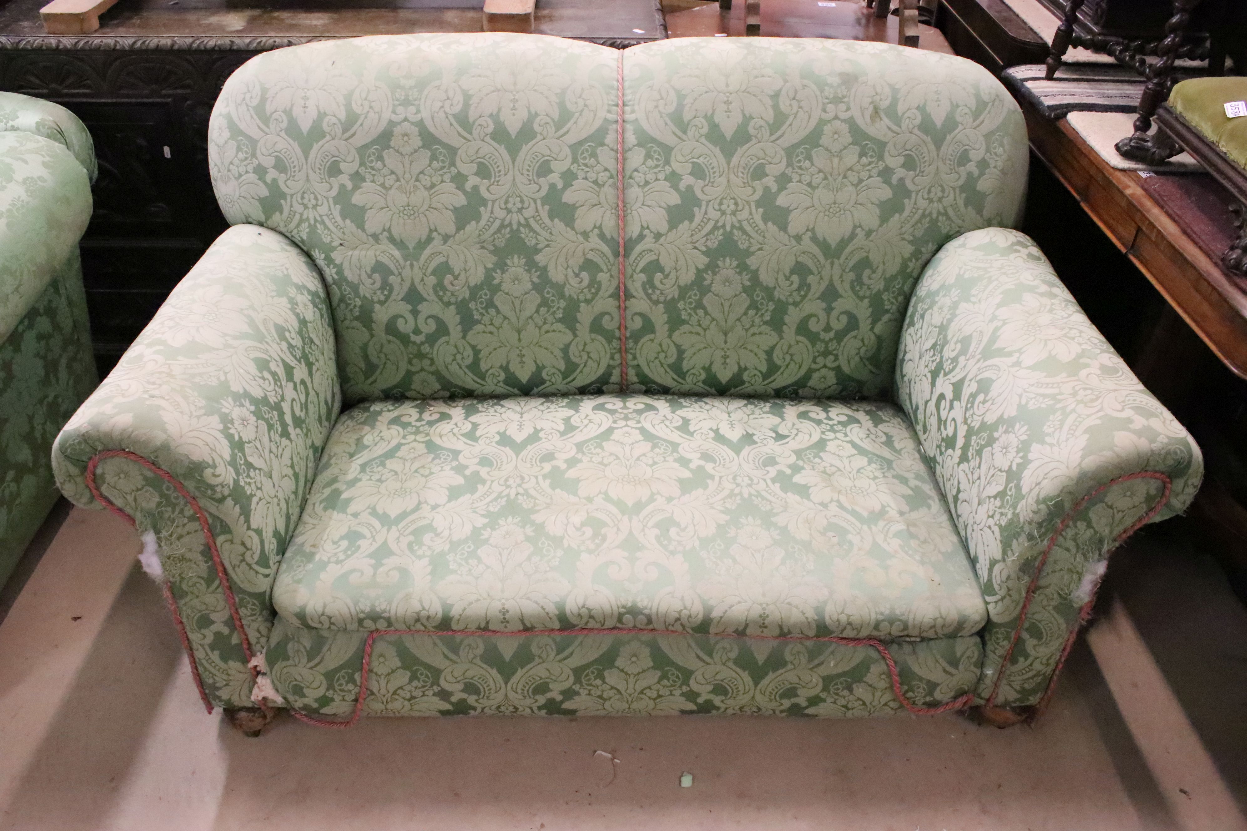 Early 20th century Two Seater Drop End Sofa, upholstered in green damask fabric sand raised on bun