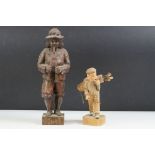 Carved oak black forest style figure depicting a piper, together with a 1930's carved wooden novelty