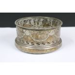 A fully hallmarked sterling silver bottle coaster, assay marked for Chester and dated for 1912.