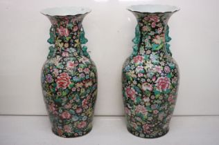 Pair of 20th century large Chinese famille rose floor standing baluster vases, with enamelled floral