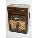 Mid century ' Blaupunkt ' Radiogram, the walnut case with hinged lid opening to a record deck, above