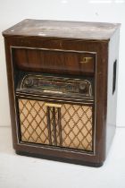 Mid century ' Blaupunkt ' Radiogram, the walnut case with hinged lid opening to a record deck, above