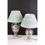 Two early 20th century lustre table lamps of urn form, with gilt details, one being decorated with a